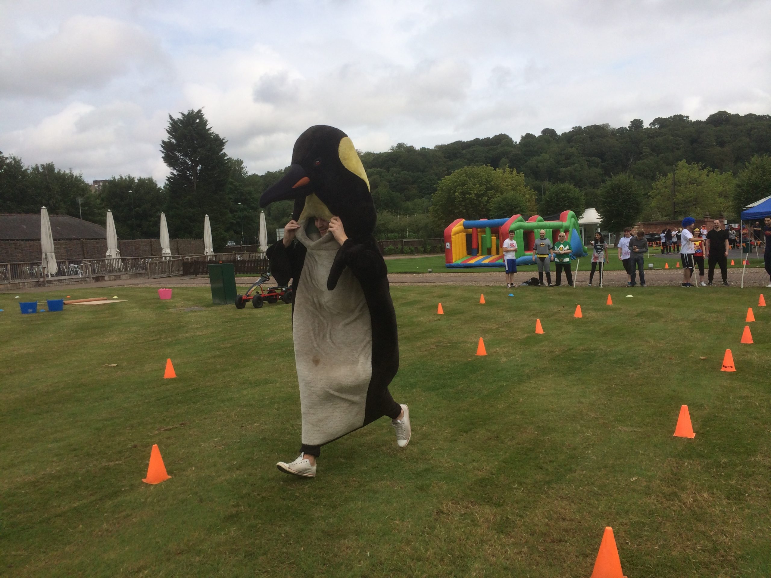 man in penguin costume outside