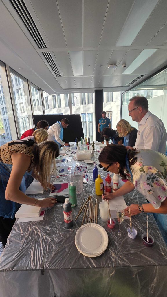 people around the table doing art craft